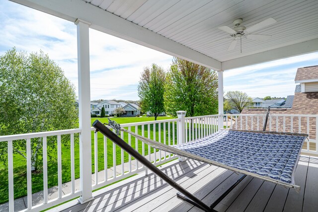 405 Anchors Way, Saint Joseph, MI 49085 - wooden terrace with ceiling fan, a residential view, and a lawn