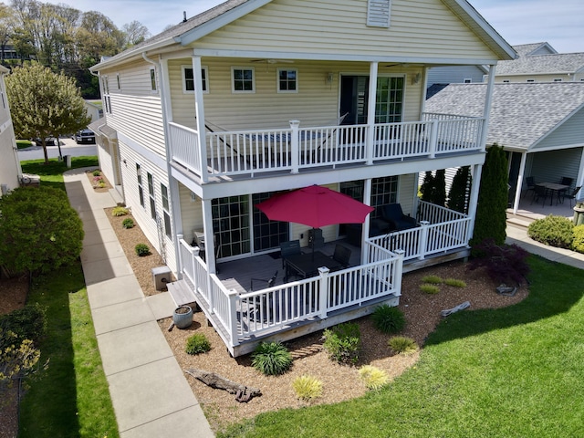 405 Anchors Way, Saint Joseph, MI 49085 - back of house featuring a balcony and a lawn