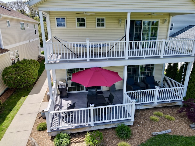 405 Anchors Way, Saint Joseph, MI 49085 - rear view of house featuring ceiling fan, a balcony, and a wooden deck