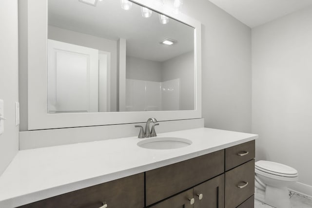 9423 Shoreway Dr, West Olive, MI 49460 - bathroom with marble finish floors, vanity, toilet, and a shower