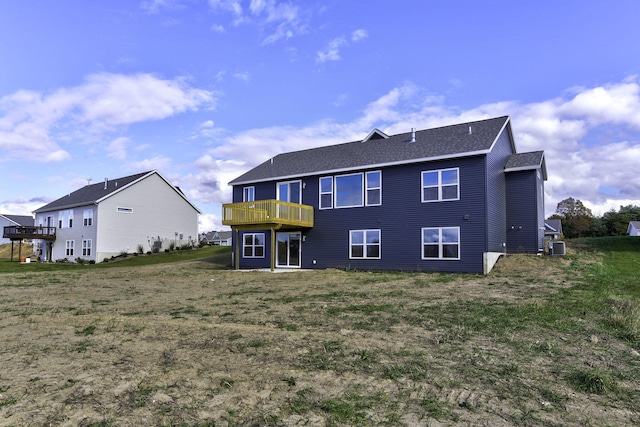 9423 Shoreway Dr, West Olive, MI 49460 - back of house with a wooden deck, roof with shingles, a lawn, and cooling unit