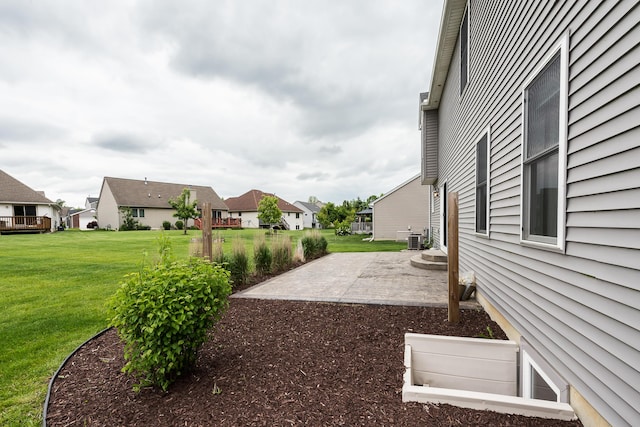 6837 Wellington Dr, Dexter, MI 48130 - view of green lawn featuring a patio area, a residential view, and central AC unit