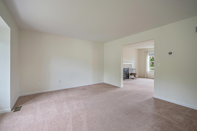 6837 Wellington Dr, Dexter, MI 48130 - carpeted empty room featuring baseboards