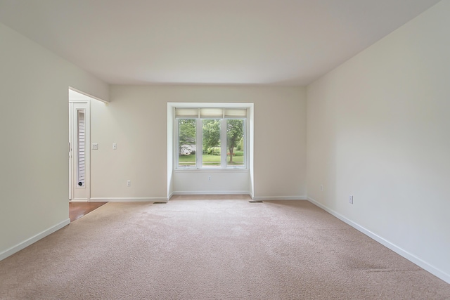 6837 Wellington Dr, Dexter, MI 48130 - carpeted spare room featuring baseboards