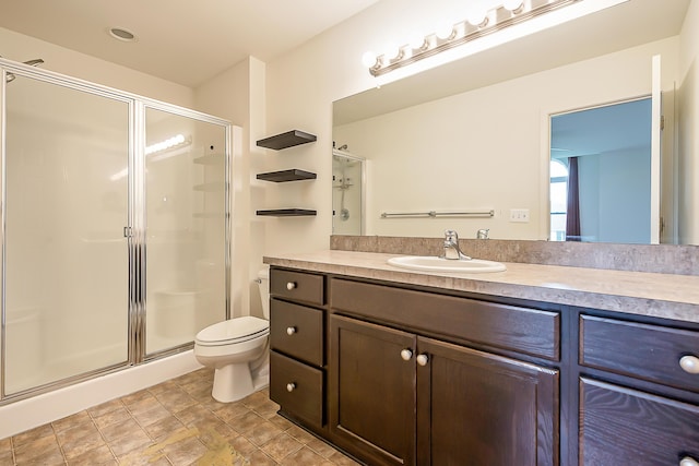 6837 Wellington Dr, Dexter, MI 48130 - bathroom featuring a stall shower, vanity, and toilet