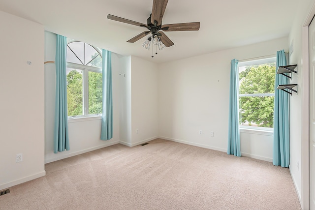 6837 Wellington Dr, Dexter, MI 48130 - carpeted spare room featuring ceiling fan, healthy amount of natural light, and baseboards