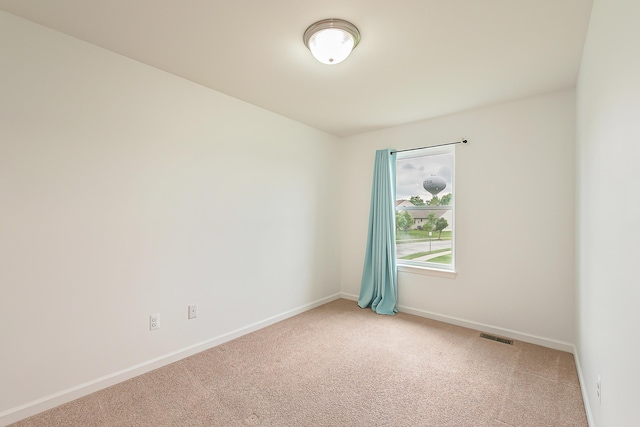 6837 Wellington Dr, Dexter, MI 48130 - empty room featuring light colored carpet and baseboards