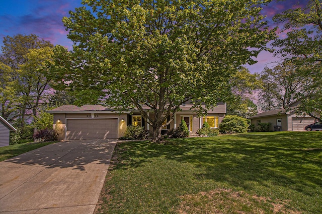 2314 Hickory Point Dr N, Portage, MI 49024 - view of property hidden behind natural elements featuring an attached garage, a front lawn, and concrete driveway