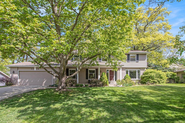 2314 Hickory Point Dr N, Portage, MI 49024 - view of front of property with a front lawn, a garage, driveway, and brick siding