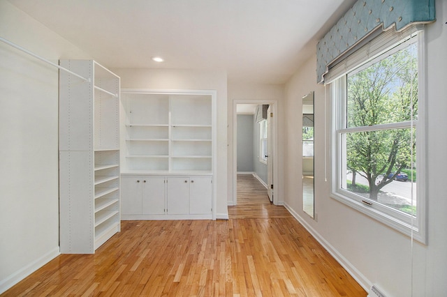 2314 Hickory Point Dr N, Portage, MI 49024 - walk in closet featuring light wood-style floors