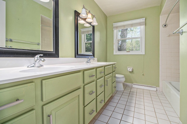 2314 Hickory Point Dr N, Portage, MI 49024 - bathroom with a baseboard radiator, tile patterned floors, toilet, double vanity, and baseboards