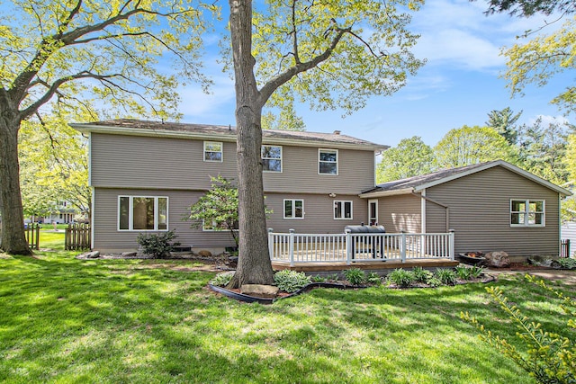 2314 Hickory Point Dr N, Portage, MI 49024 - back of property with a deck and a lawn