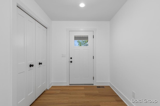 4020 Tall Timber Dr NW, Grand Rapids, MI 49534 - entryway featuring baseboards, light wood-style floors, and recessed lighting