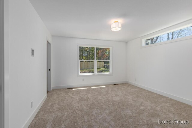 4020 Tall Timber Dr NW, Grand Rapids, MI 49534 - spare room with carpet and baseboards