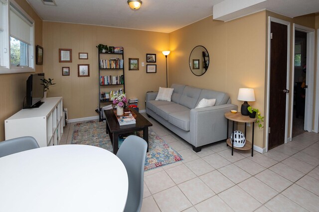 9017 N Main St, Berrien Springs, MI 49103 - living area featuring light tile patterned flooring and baseboards