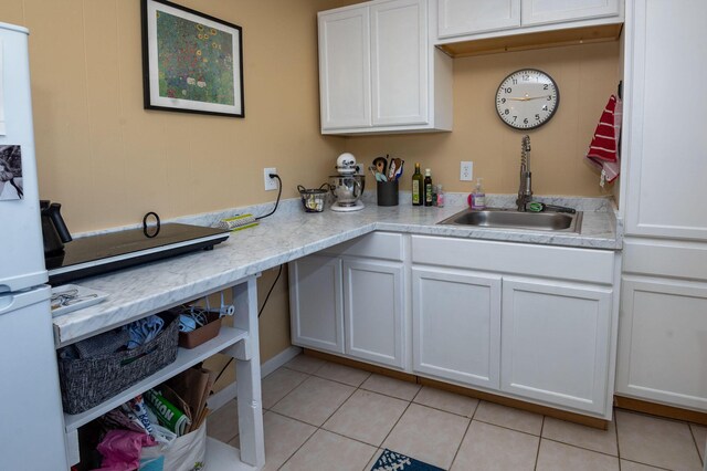 9017 N Main St, Berrien Springs, MI 49103 - kitchen with a sink, light tile patterned floors, light countertops, and white cabinetry