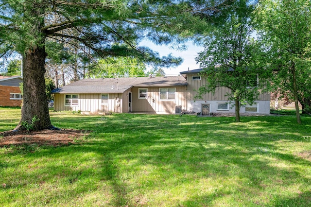 9017 N Main St, Berrien Springs, MI 49103 - back of house featuring a yard and board and batten siding