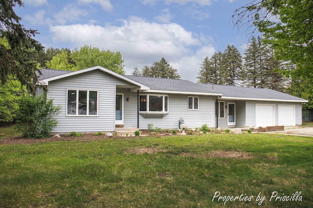 315 Hayes St NW, Comstock Park, MI 49321 - single story home with a garage, a front lawn, and roof with shingles