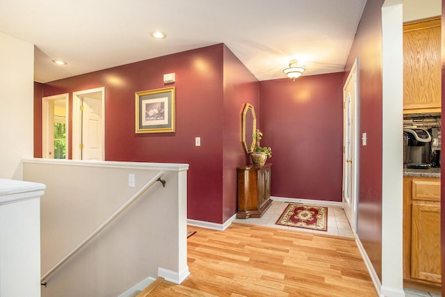 232 Embury Dr, Battle Creek, MI 49014 - hall featuring an upstairs landing, light wood-style floors, recessed lighting, and baseboards