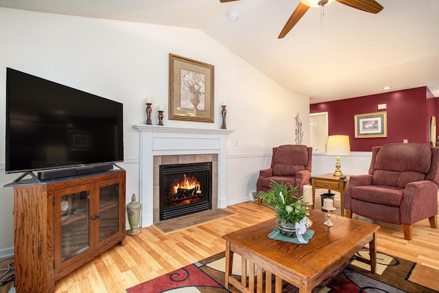 232 Embury Dr, Battle Creek, MI 49014 - living area with a ceiling fan, wood finished floors, lofted ceiling, and a fireplace