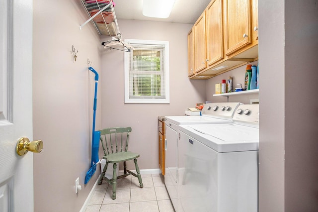 232 Embury Dr, Battle Creek, MI 49014 - laundry area with separate washer and dryer, cabinet space, light tile patterned flooring, and baseboards