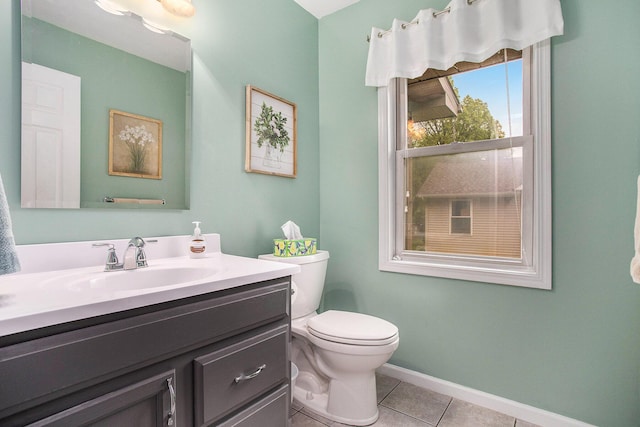 232 Embury Dr, Battle Creek, MI 49014 - bathroom featuring vanity, tile patterned flooring, toilet, and baseboards