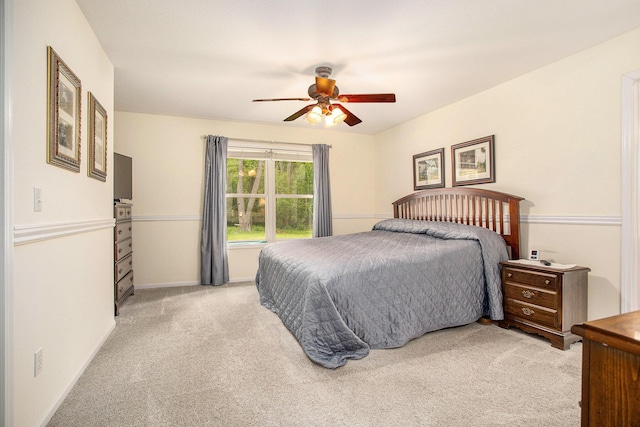 232 Embury Dr, Battle Creek, MI 49014 - bedroom featuring light colored carpet, ceiling fan, and baseboards