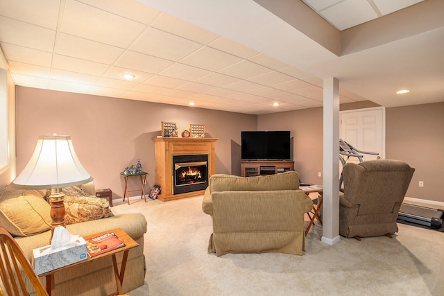 232 Embury Dr, Battle Creek, MI 49014 - living room featuring carpet floors, a warm lit fireplace, recessed lighting, a drop ceiling, and baseboards
