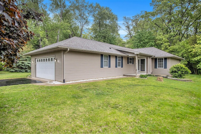232 Embury Dr, Battle Creek, MI 49014 - ranch-style house with an attached garage, asphalt driveway, a front yard, and a shingled roof