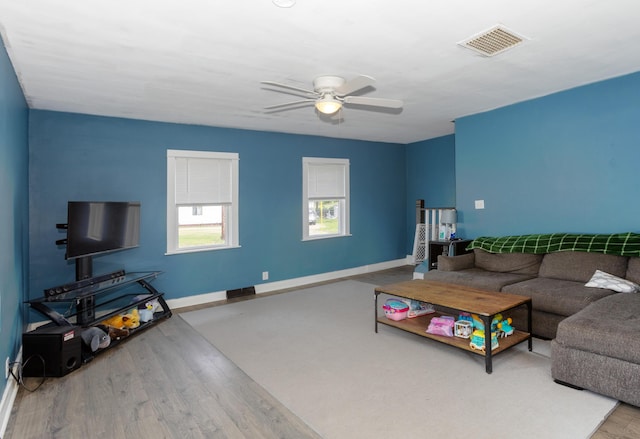 104 S Lowe St, Dowagiac, MI 49047 - living room with a ceiling fan, wood finished floors, and baseboards