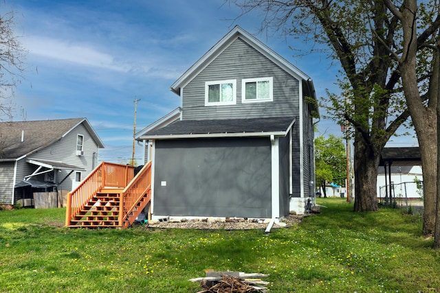 104 S Lowe St, Dowagiac, MI 49047 - back of house with stairway, a yard, and a wooden deck