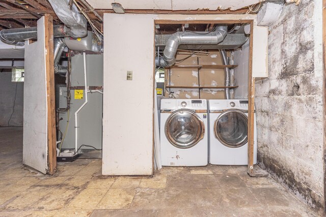 885 Hawthorne Ave, Ypsilanti, MI 48198 - laundry area with washing machine and clothes dryer and heating unit