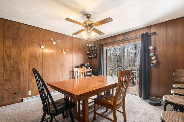 50427 M 51 N, Dowagiac, MI 49047 - dining space with light carpet, ceiling fan, and wooden walls