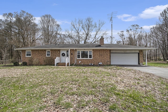 50427 M 51 N, Dowagiac, MI 49047 - ranch-style home with a garage, a chimney, concrete driveway, a front yard, and brick siding