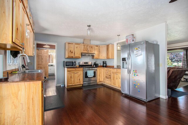32867 Middle Crossing Rd, Dowagiac, MI 49047 - kitchen featuring appliances with stainless steel finishes, a sink, under cabinet range hood, dark countertops, and a textured ceiling