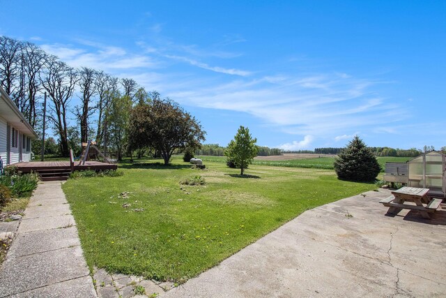 32867 Middle Crossing Rd, Dowagiac, MI 49047 - view of green lawn with a patio and a deck