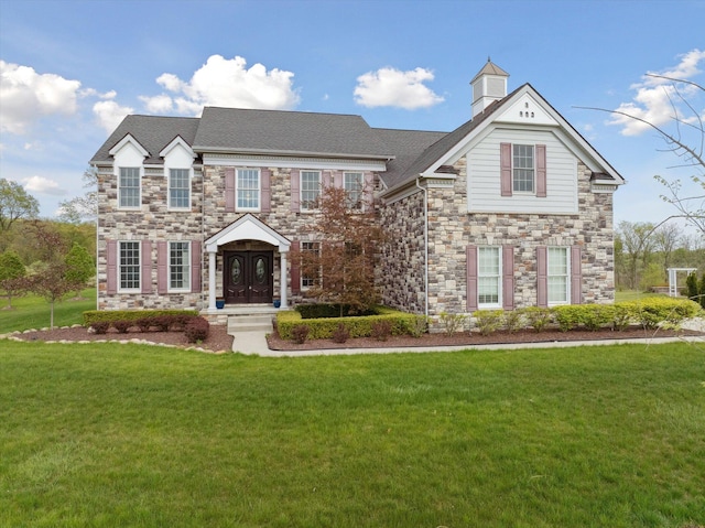 1840 Tapadera Dr, Ann Arbor, MI 48103 - view of front facade with stone siding and a front lawn