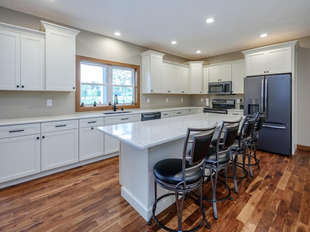 1518 M Dr S, East Leroy, MI 49051 - kitchen featuring stainless steel appliances, white cabinetry, dark wood finished floors, and recessed lighting