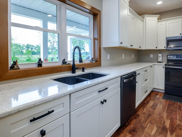 1518 M Dr S, East Leroy, MI 49051 - kitchen with stainless steel appliances, dark wood finished floors, white cabinetry, light stone countertops, and recessed lighting