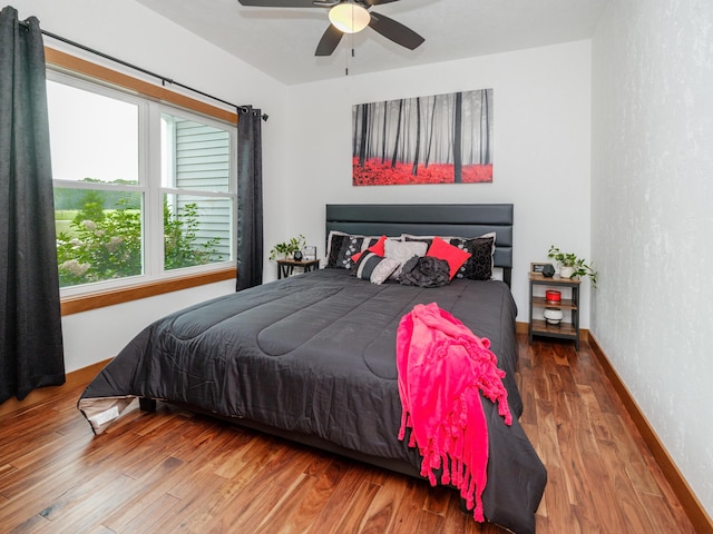 1518 M Dr S, East Leroy, MI 49051 - bedroom featuring wood finished floors, a textured wall, and ceiling fan