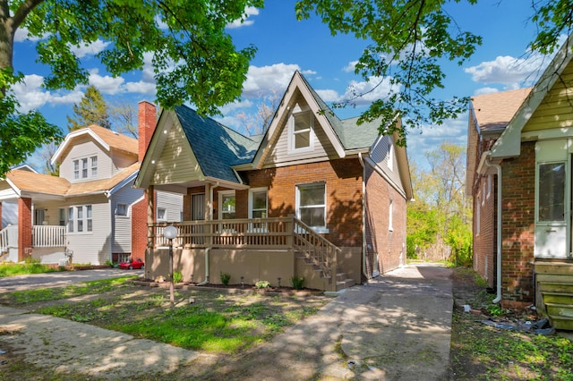 16568 Monica St, Detroit, MI 48221 - view of front facade featuring brick siding and a chimney