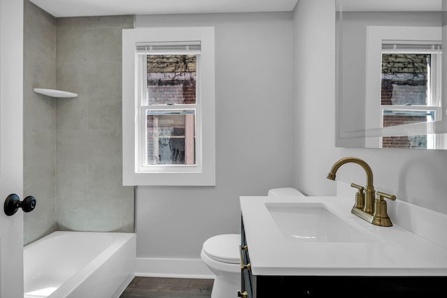 16568 Monica St, Detroit, MI 48221 - full bathroom with vanity, toilet, baseboards, wood finished floors, and shower / tub combination