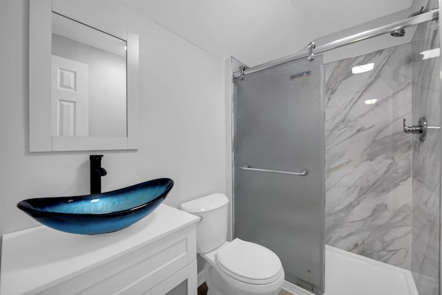 16568 Monica St, Detroit, MI 48221 - bathroom with a marble finish shower, vanity, and toilet