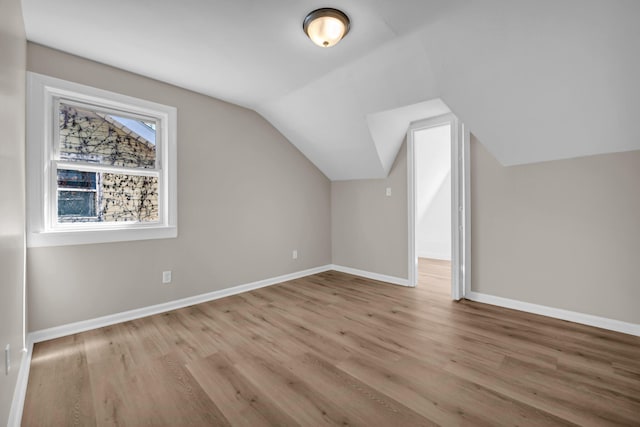 16568 Monica St, Detroit, MI 48221 - bonus room featuring baseboards, wood finished floors, and lofted ceiling
