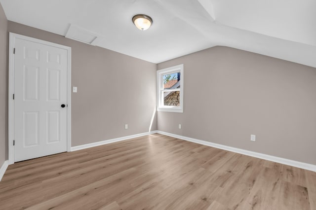 16568 Monica St, Detroit, MI 48221 - additional living space featuring attic access, light wood-style flooring, baseboards, and vaulted ceiling