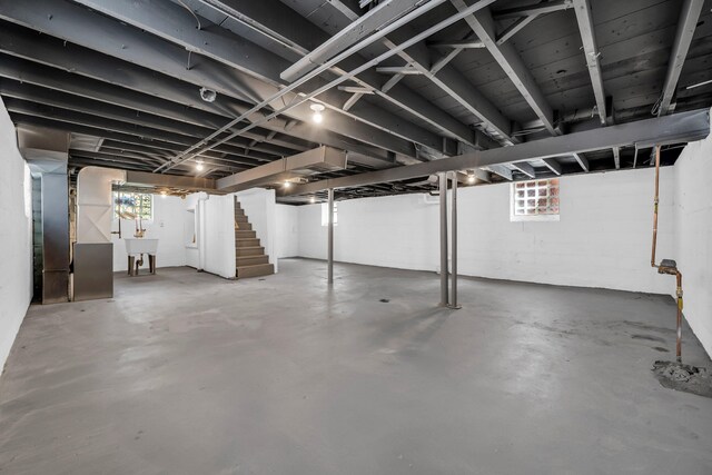 16568 Monica St, Detroit, MI 48221 - basement featuring stairs, a sink, and heating unit