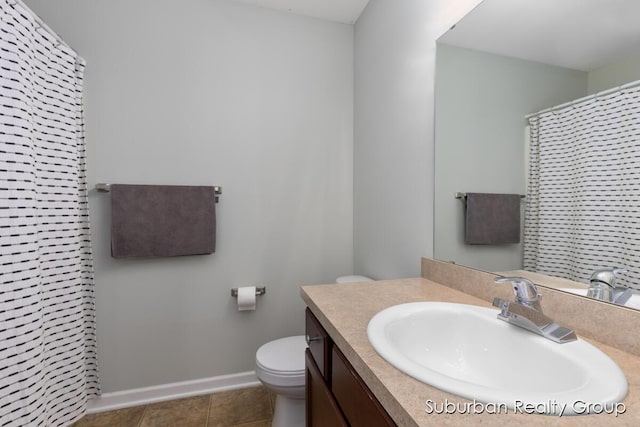 bathroom featuring toilet, vanity, baseboards, tile patterned floors, and a shower with curtain