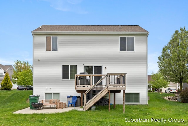 rear view of property featuring a wooden deck, a yard, a patio, and stairway