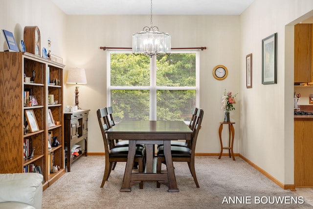 10852 Thornberry Way, Zeeland, MI 49464 - dining room featuring a chandelier and light carpet