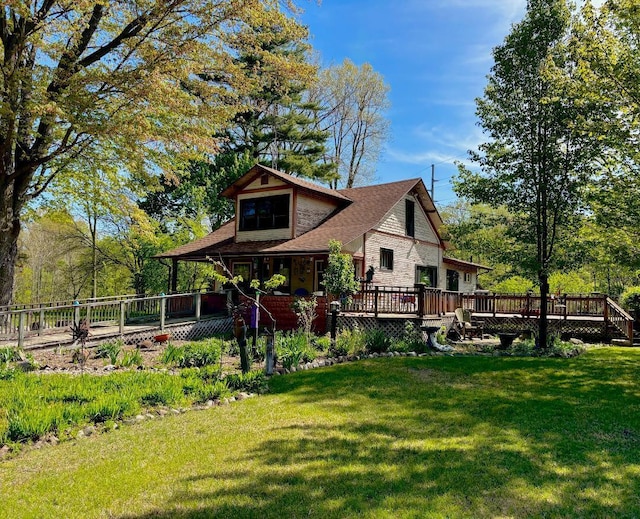 6056 Clary Ct, Sawyer, MI 49125 - back of property with a yard, a wooden deck, and a shingled roof